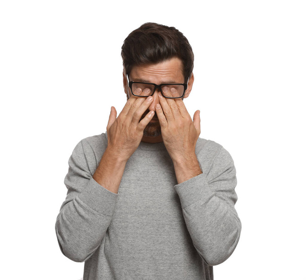 Man suffering from eyestrain on white background - Fotó, kép