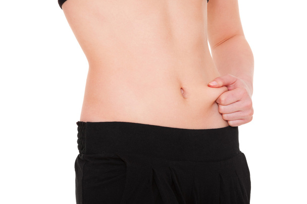 Menina mede gordura em seu estômago
 - Foto, Imagem