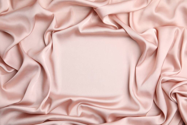 Texture of delicate pink silk as background, top view - Foto, afbeelding