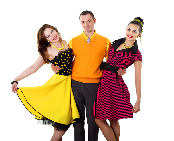 Young man with two women in bright colour wear - Fotoğraf, Görsel