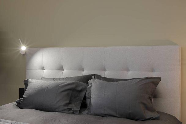 Double bed in a modern bedroom interior  - Fotó, kép