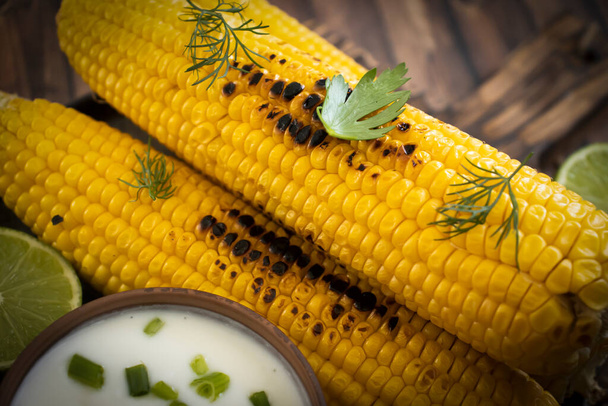 Grilled corn on old background - Zdjęcie, obraz