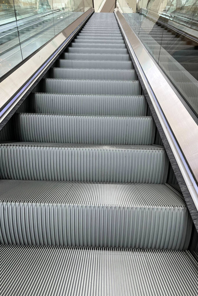 Escalator in shopping mall or building - 写真・画像
