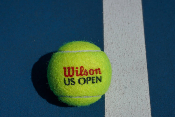 NEW YORK - AUGUST 16, 2022: US Open Wilson tennis ball. Wilson is the Official Ball of the US Open since 1979 - Zdjęcie, obraz