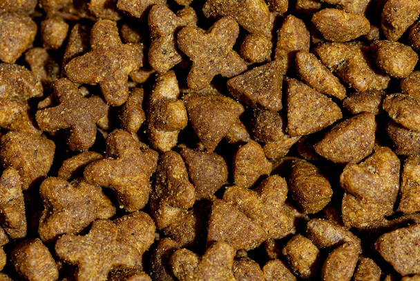 Dog or cat food or kibble shot up close. Top view background.  - Foto, afbeelding