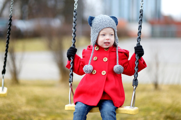 Little girl on swing - Фото, изображение