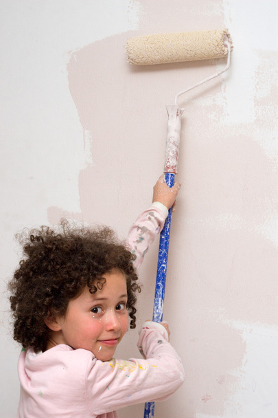 Girl painting a wall - Photo, Image
