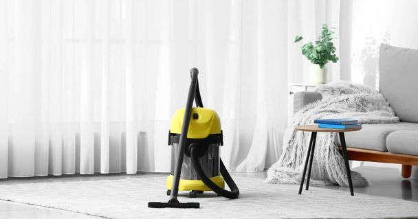 Modern vacuum cleaner in room - Foto, Imagen