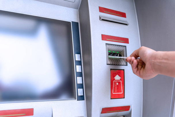 Atm machine money. Hand holding money bank credit card. Withdraw money cash from atm. Us dollar bill, bank credit card - Foto, imagen