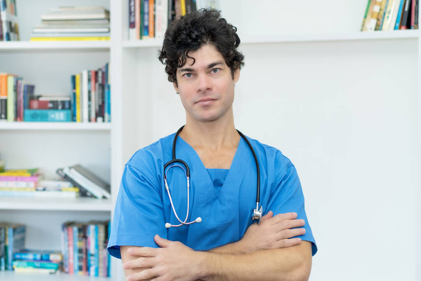 Friendly caucasian male nurse or doctor at office of hospital - Fotoğraf, Görsel