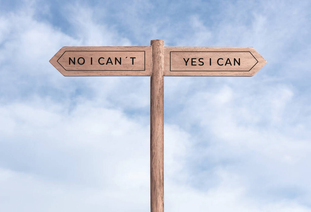 Yes I can concept or No I can not. Signpost with two messages on opposite way and sky background - Foto, Imagen