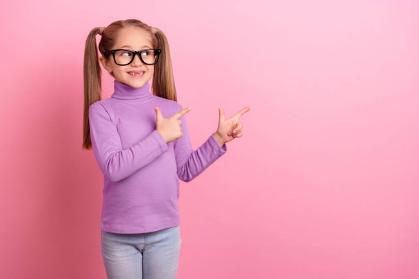 Photo of pretty little girl promote recommend online education courses isolated on pink color background. - Valokuva, kuva