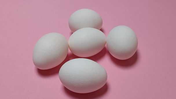 Uncooked egg in white color with white background food meal lunch dinner breakfast healthy eating  - Fotó, kép