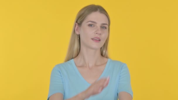 Rejecting Casual Young Woman Denying on Yellow Background  - Materiaali, video
