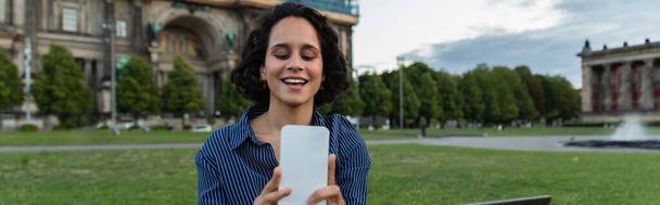 cheerful woman taking selfie on smartphone near cathedral in berlin, banner - Fotó, kép