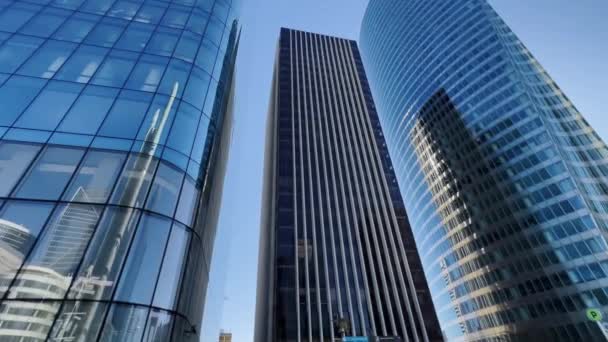 Modern office high rise skyscraper buildings. City business district. Looking up at business buildings. Low angle view of business buildings. Paris France. High quality 4k footage - Imágenes, Vídeo