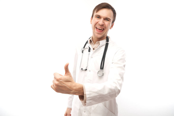 Portrait of happy doctor in white medical coat showing gesture all is well isolated on white background with copy space - Φωτογραφία, εικόνα