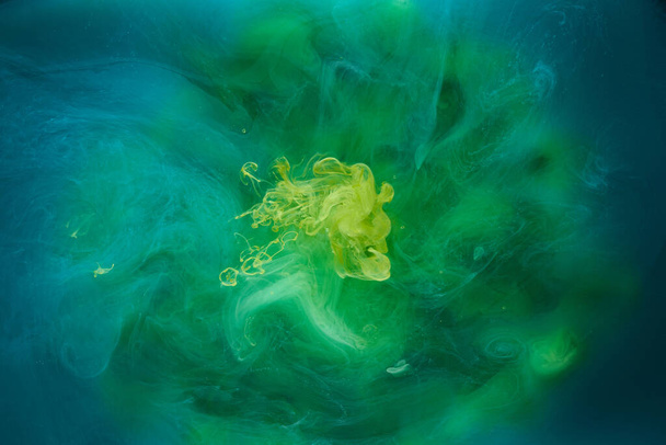 Liquid fluid art abstract background. Blue green acrylic paint underwater, galactic smoke ocean - Fotó, kép