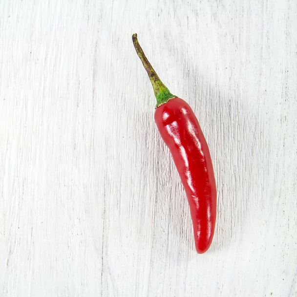 Close up fresh chili peppers on wooden background - Photo, Image