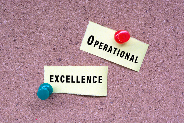 Operational excellence words on stick note and pinned to a cork notice board. Business concept. - Fotó, kép