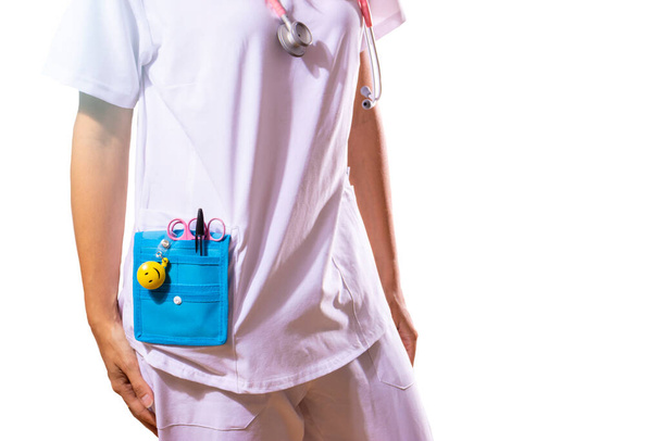 Girl doctor organizing her medical tools. White background. Copy space. - 写真・画像