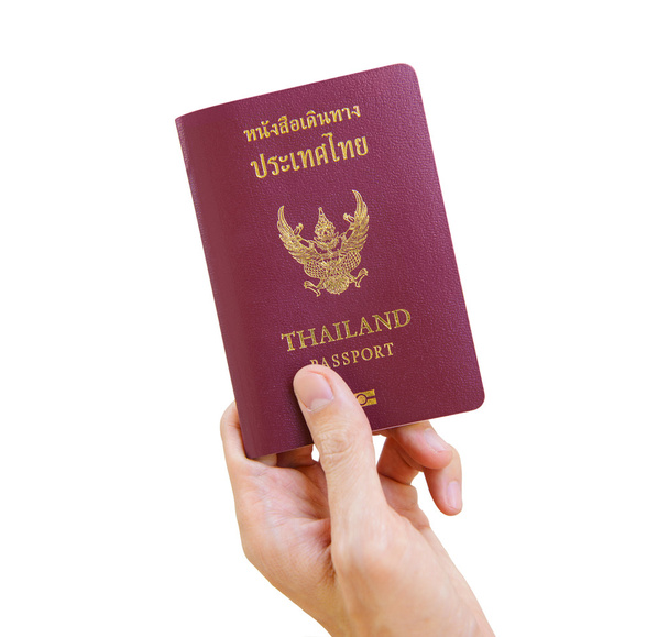 Mano con pasaporte tailandés
 - Foto, Imagen