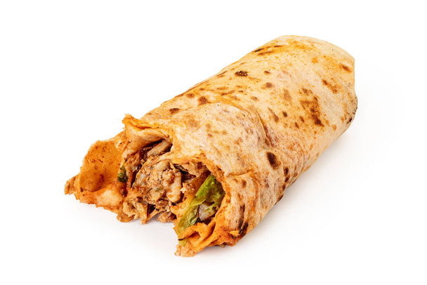 Isolated on a white background, Turkish doner or durum is a fast food with meat and salad wrapped in a flatbread. Unhealthy and greasy food - Fotó, kép