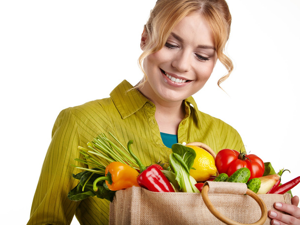 Woman with a grocery shopping bag - Fotoğraf, Görsel