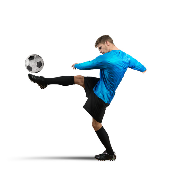 Soccer player kicks the ball - Foto, afbeelding