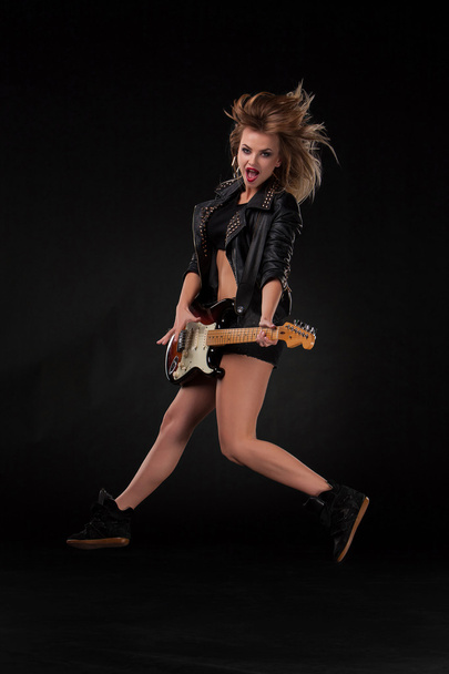 Beautiful girl playing guitar - Фото, зображення