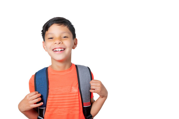 Boy with his backpack very happy about going back to school on white background. Back to school concept. High quality photo - Foto, imagen