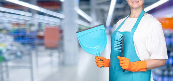 Cleaner with dustpan and brush on blurred background. - Foto, Imagen