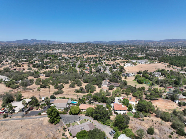 Aerial view of dry valley and land with houses and barn in Escondido, San Diego, California - Photo, Image