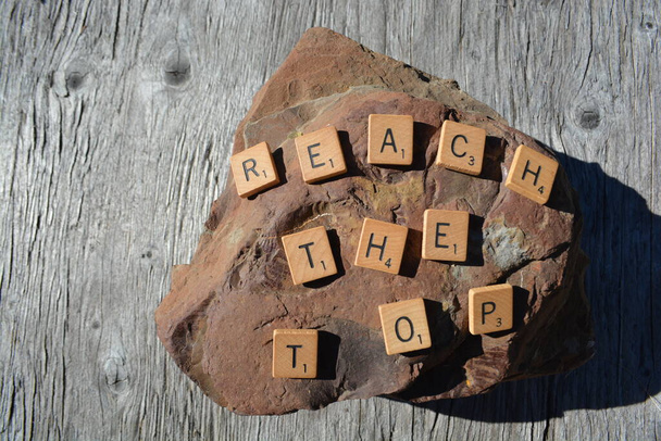 Motivational Scrabble word are on a big rock - with fossils - Foto, immagini