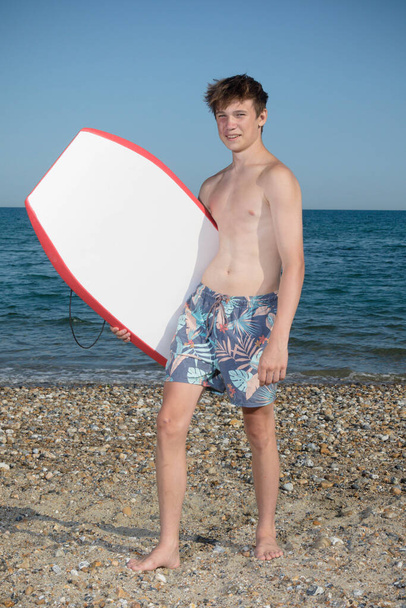 A 17 Year Old Teenage Boy With A body Board - Photo, Image