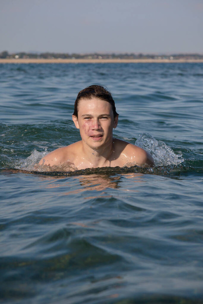 A 17 Year Old Teenage Boy Swimming In The Sea - Фото, изображение