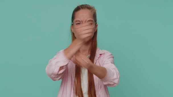 Stop. Teenager girl say No hold palm folded crossed hands in stop gesture, warning of finish, prohibited access, declining communication, body language, danger. Child kid isolated on blue background - Materiał filmowy, wideo