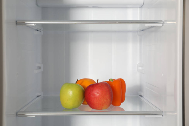 Fresh products on shelf inside modern refrigerator - Фото, зображення