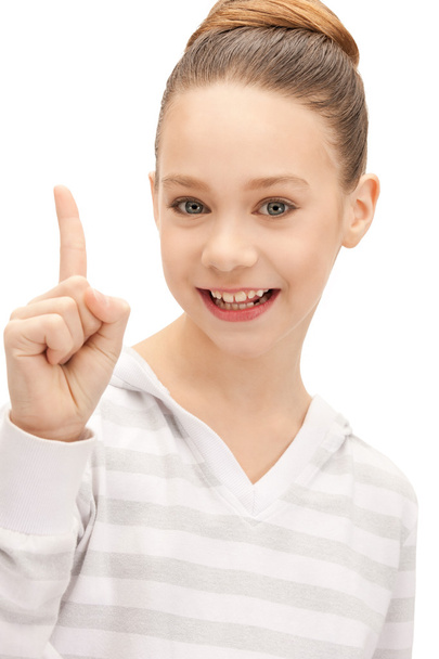 Teenage girl with her finger up - Φωτογραφία, εικόνα