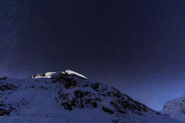Landscape with mountains and blue sky in winter night - Foto, immagini