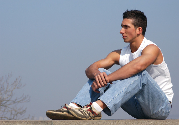 Young sexy man sitting - Photo, image