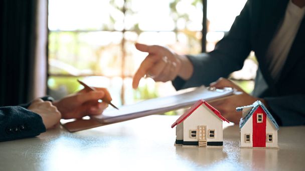 Costumer signing contract, making sale purchase property with agent. Real estate investment and Property purchase concept. - 写真・画像