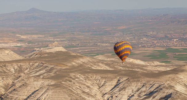 Cappadocia is the region that emerged when the soft layers formed by lava and ashes erupted by Erciyes, Hasanda and Gllda 60 million years ago were eroded by rain and wind over millions of years. - Zdjęcie, obraz