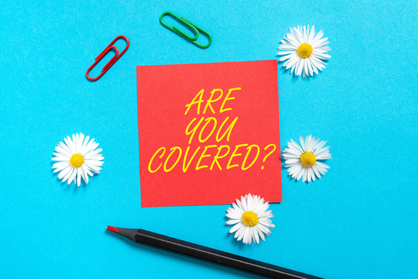 Conceptual caption Are You Covered, Internet Concept Asking about how medications are covered by your plan Sticky Note With New Ideas With Paperclips, Pencil And Flowers Around. - Fotoğraf, Görsel