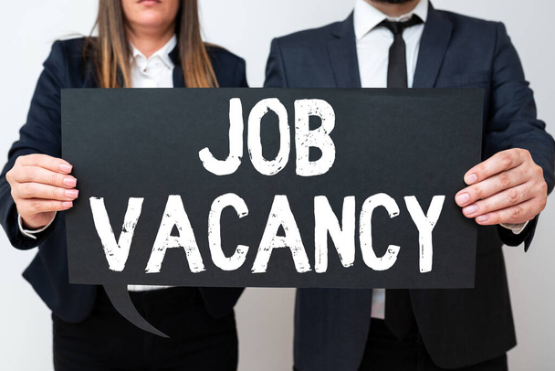 Conceptual display Job Vacancy, Business concept empty or available paid place in small or big company Business Team Holding Important Information On Speech Bubble On Both Sides. - Fotó, kép