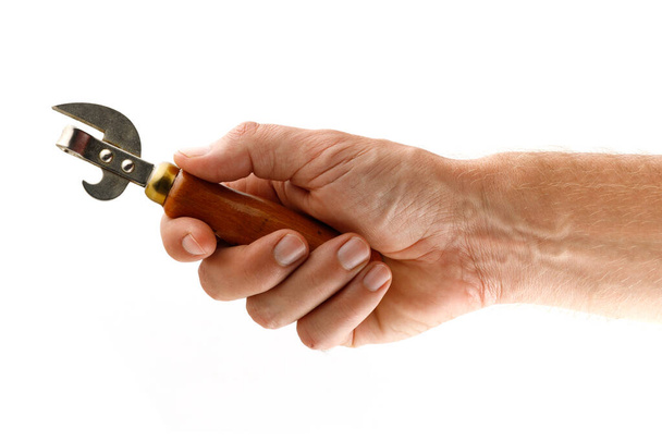 Hand holds bottle opener isolate - Photo, Image