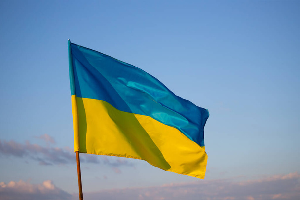 Detail of the national flag of Ukraine waving in the wind on a clear day. Democracy and politics.  - Foto, imagen