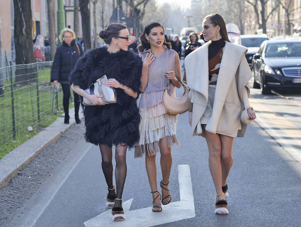 Fashion blogger Karina Nigai, Mary Leest and Kasia walking in the street after Fendi fashion show during Milano fashion week woman fall/winter collections - Foto, Imagen