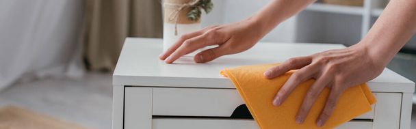 partial view of housewife wiping bedside table with rag, banner - Fotoğraf, Görsel