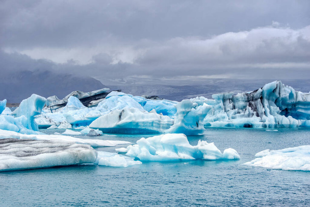 Ice floes at Jokulsarlon glacial lagoon in Iceland - most famoust tourist attraction - Photo, image